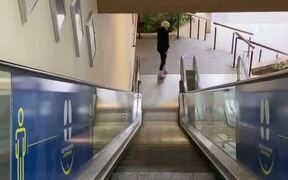 Woman Slides Down Escalator on Roller Skates - Fun - VIDEOTIME.COM