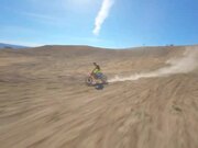 Bikers Perform Stunts in Desert