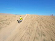 Bikers Perform Stunts in Desert