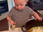 Toddler Actively Participates in Cooking Turkey
