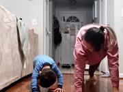 Cute Toddler Practices Yoga With Mother