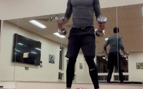 Man Does Workout With Dumbbells
