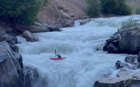 Person Kayaks Downstream in River - Sports - VIDEOTIME.COM