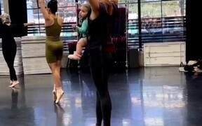  Woman Practices Ballet While Holding Her Baby - Fun - VIDEOTIME.COM