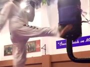 Taekwondo Champion Kicks Punching Bag Speedily