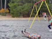 Kids Jump Off Swing Set Playfully