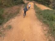 Mountain Bike Riders Jump High Off Hills