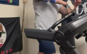 Dad Carrying Daughter on Treadmill
