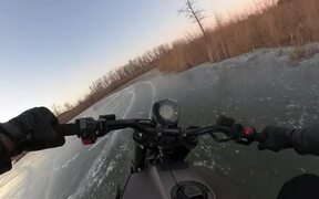 Man Rides Motorbike on Frozen Lake - Tech - VIDEOTIME.COM
