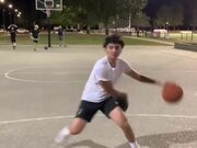 Guy Simultaneously Dribbles Two Basketball