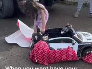 A Girl Gets Excited About Receiving Police Toy Car