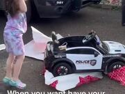 A Girl Gets Excited About Receiving Police Toy Car