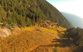 Person Paraglides Smoothly Over Mountain Range - Fun - VIDEOTIME.COM