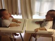 Twin Babies Play Together and Laugh at Each Other