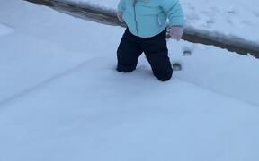 Baby Eealizes That Playing In The Snow Isn't Easy