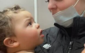 Baby Takes Off Mother's False Eyelash