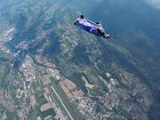 Skydive Wingsuit Training Amidst Scenic Landscape