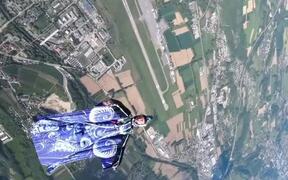 Skydive Wingsuit Training Amidst Scenic Landscape - Sports - VIDEOTIME.COM