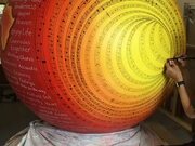 Woman Creates Art on Medicine Ball