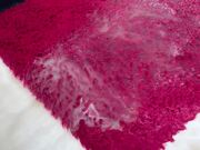 Footage of Water Getting Wiped Off a Red Rug