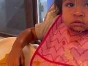 Kid Makes Mess With Food and Spills it on Her Face