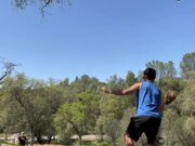 Guy Balances Himself on Slackline and Plays Catch