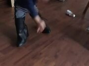 Girl Stumbles Around in Boots Bigger Than Her Size