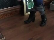 Girl Stumbles Around in Boots Bigger Than Her Size