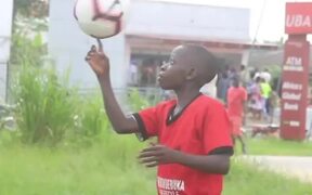 Kid Spins Soccer Ball Over His Finger - Kids - VIDEOTIME.COM