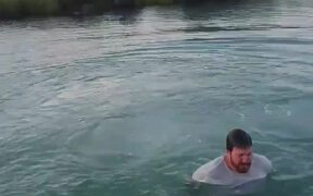 Person Trying to Ride Cycle Falls in Water - Sports - VIDEOTIME.COM
