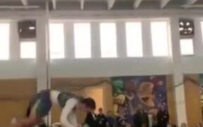Athletes Attempt Acrobatic Dunk Using Trampoline