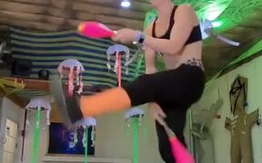 Girl Dances and Simultaneously Carries Out Tricks