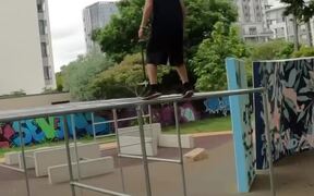 Man Parkours Across Obstacle Course in Park