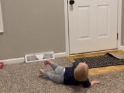 Toddler Can't Help But Roll On The Floor And Laugh