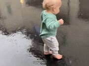 Baby Boy And His Ability To Jump In The Rain