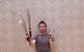 Guy Lays Down on Back and Juggles Knives