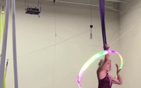 Woman Spins Hulahoop On Her Hand