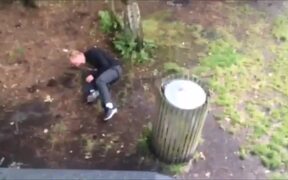 Guy Falls While Jumping on Trash Can