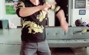 Guy Performs Tricks With Nunchucks