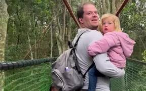 Joyful Gibbon Ape Swings Over Tourist Family - Animals - Videotime.com