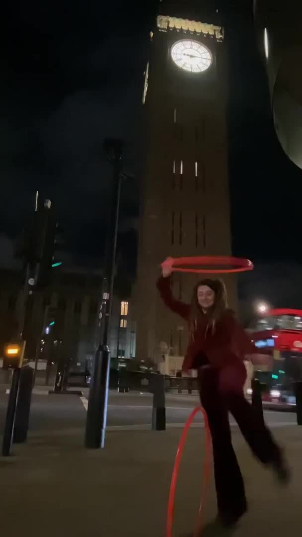 Woman Does Tricks With Three Hula Hoops