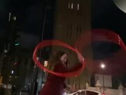 Woman Does Tricks With Three Hula Hoops