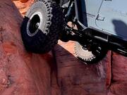 Person Slowly Climbs Huge Rock in His Jeep