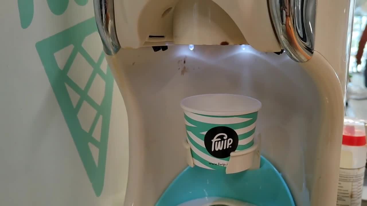 Man Fails to Fill Cup From Faulty IceCream Machine