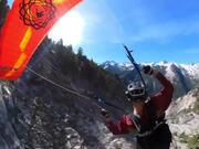 Person Performs Tricks While Speed-Flying Downhill