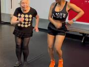 Old Woman Dances With Trainer