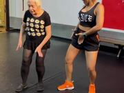 Old Woman Dances With Trainer