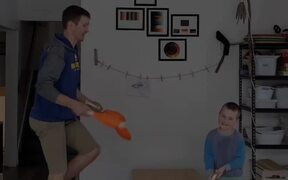 Dad and Son Juggles Balls
