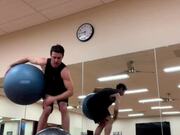 Guy Attempts Balancing Trick Using Stability Balls