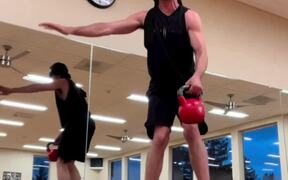 Guy Attempts Balancing Trick Using Stability Balls
